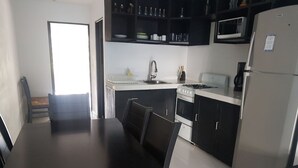 Junior Suite | Private kitchen | Coffee/tea maker, full-size fridge, microwave, oven - New Condo in the Hotel Zone (Cancun)