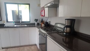 Villa | Private kitchen | Coffee/tea maker, full-sized fridge, microwave, oven - Ocean Front Villa Hotel Zone (Cancun)
