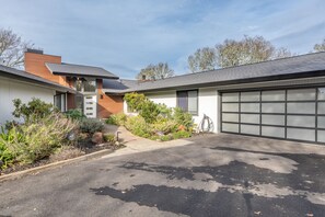 A modern two-story house with a garage, a driveway, and a well-maintained garden. - Gorgeous Vineyard Views, Large private home w/heated Pool & Hot Tub included! (Glen Ellen)