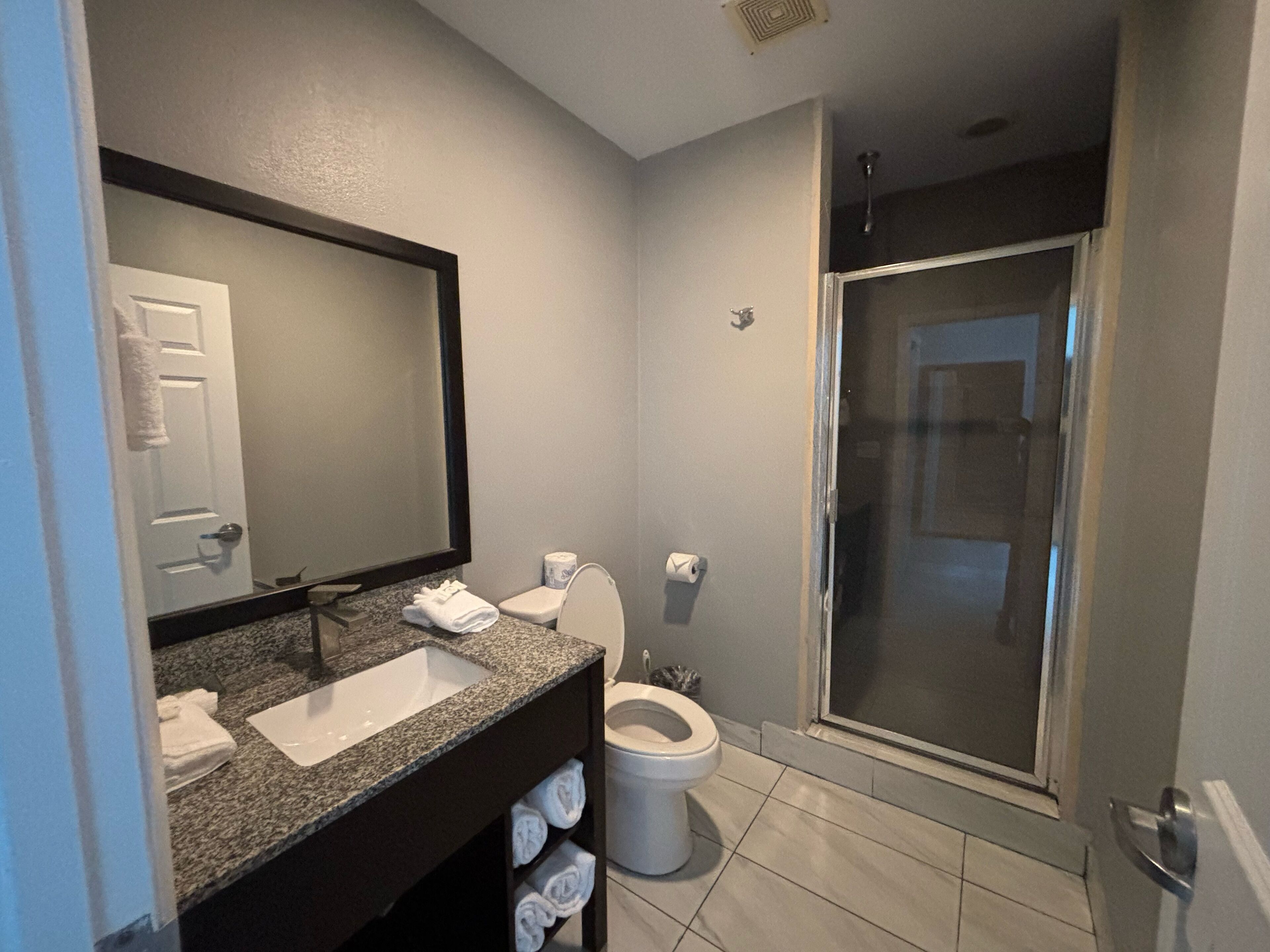studio suite | bathroom | shower, hair dryer, towels