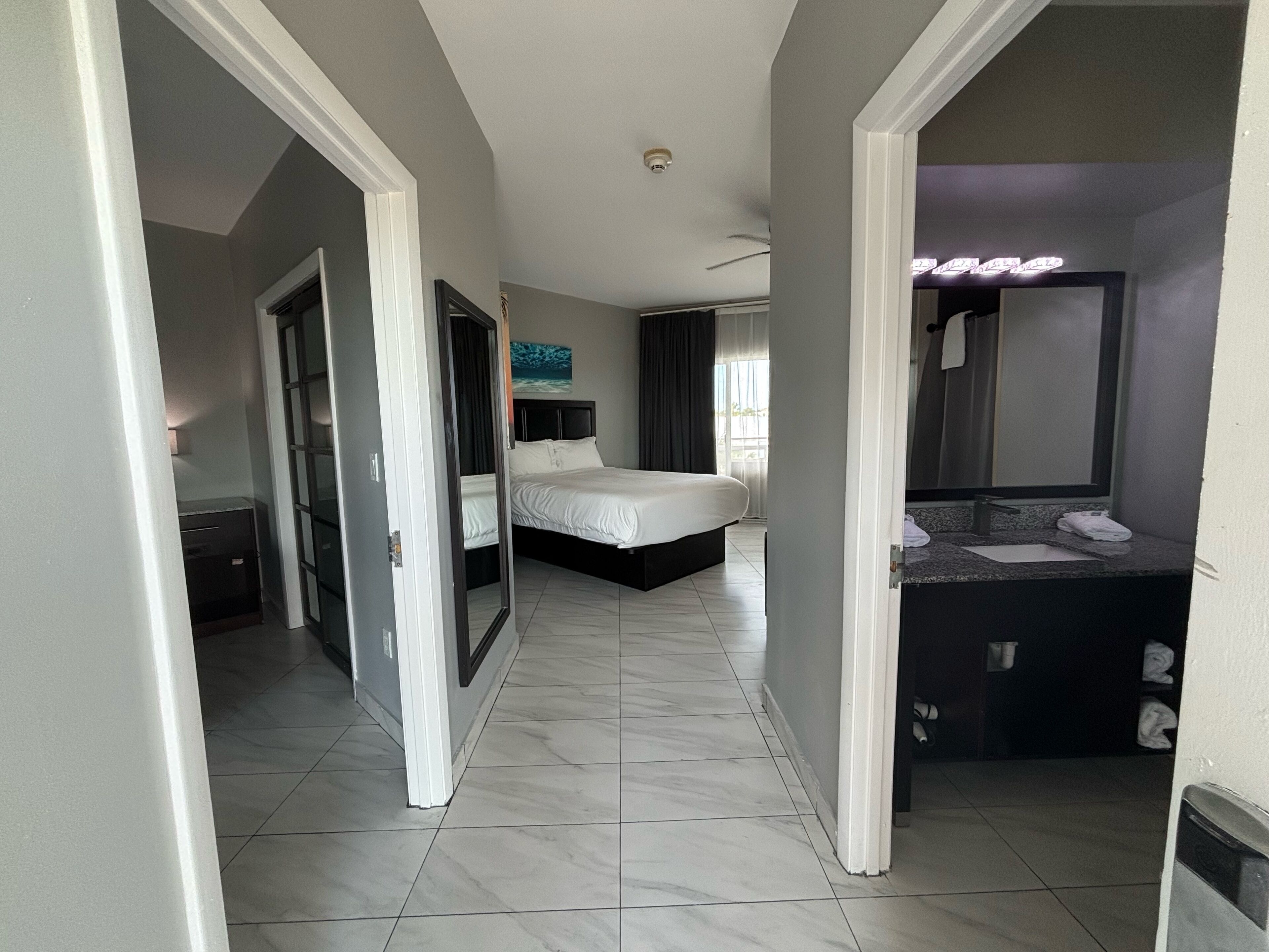 signature room, 1 bedroom, balcony, pool view | 1 bedroom, hypo-allergenic bedding, in-room safe, desk