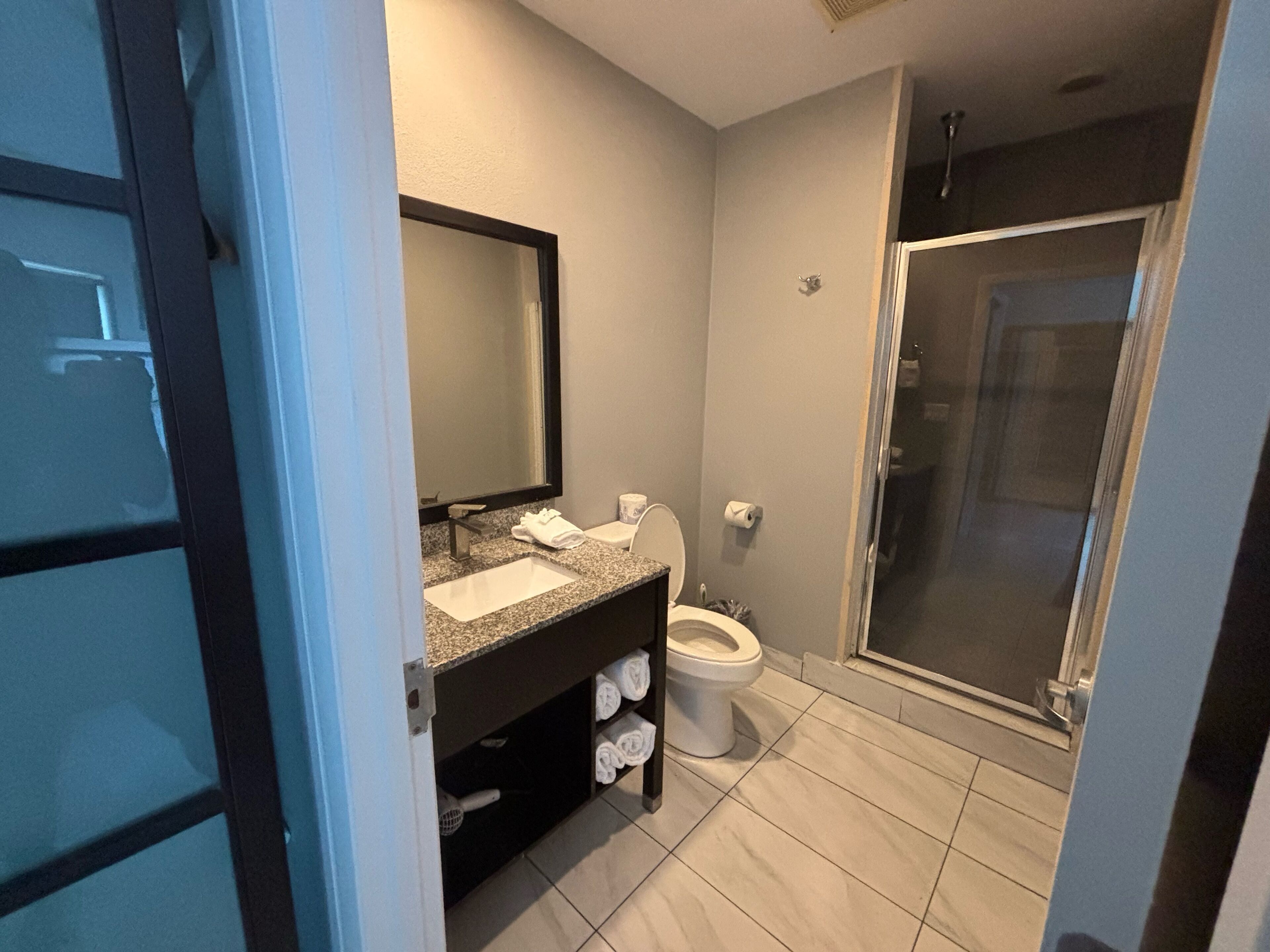 studio suite | bathroom | shower, hair dryer, towels
