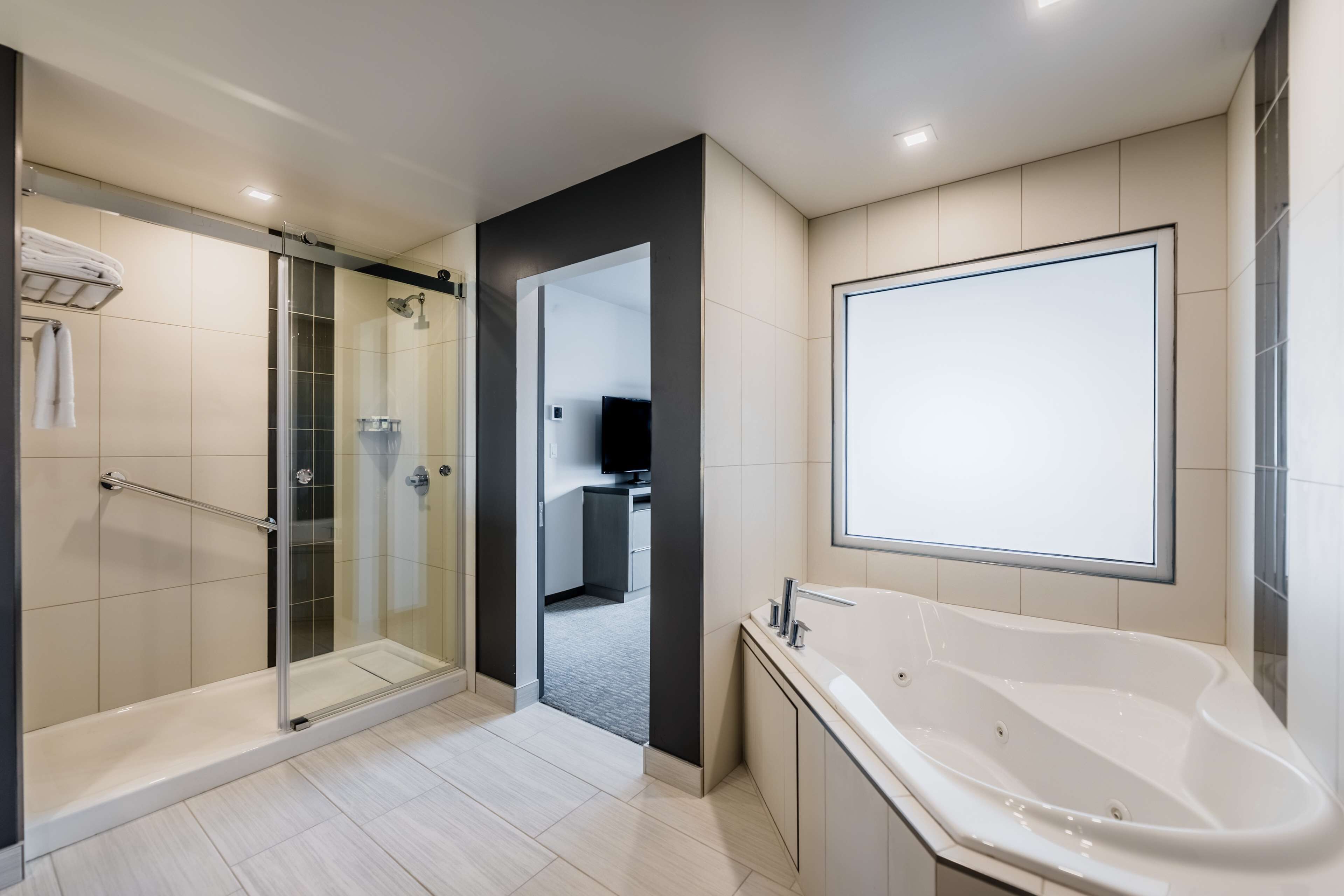 designer toiletries, hair dryer, towels, soap