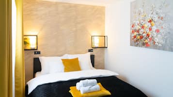 Quarto triplo família, 2 quartos, banheiro privativo | Roupas de cama premium, edredons de pluma, frigobar, cofres nos quartos