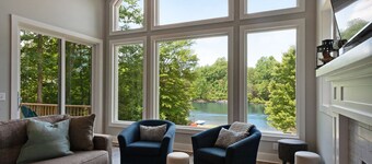 Custom lakefront home with private beach, dock & firepit