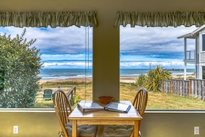 Enjoy the ocean view from this room's window, which offers a view of the beach and ocean.