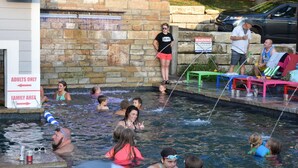 A swimming pool with an 'Adults Only' sign and a 'Family Area' sign. - Lakefront Retreat Sleeps 19 • Hot Tub + Paddle Boards • Family & Group Favorite! (Eldon)