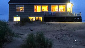 A two-story beach house with a covered porch and a small deck. - Beach and Bay Views, Family Friendly, Immaculate, Chef's Kitchen, Beach Front (Waldport)