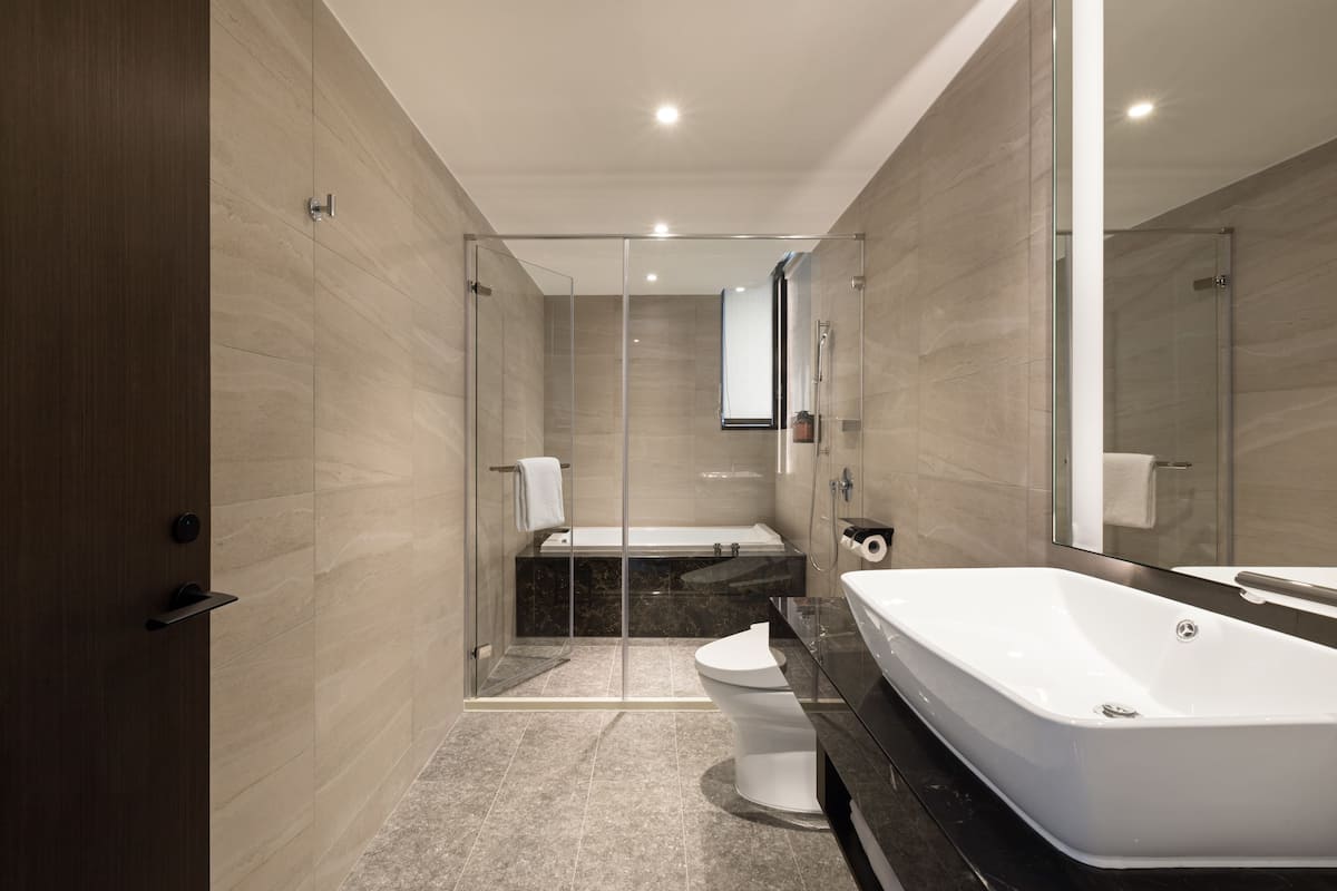 lakeshore suite | bathroom | hair dryer, slippers, bidet, towels
