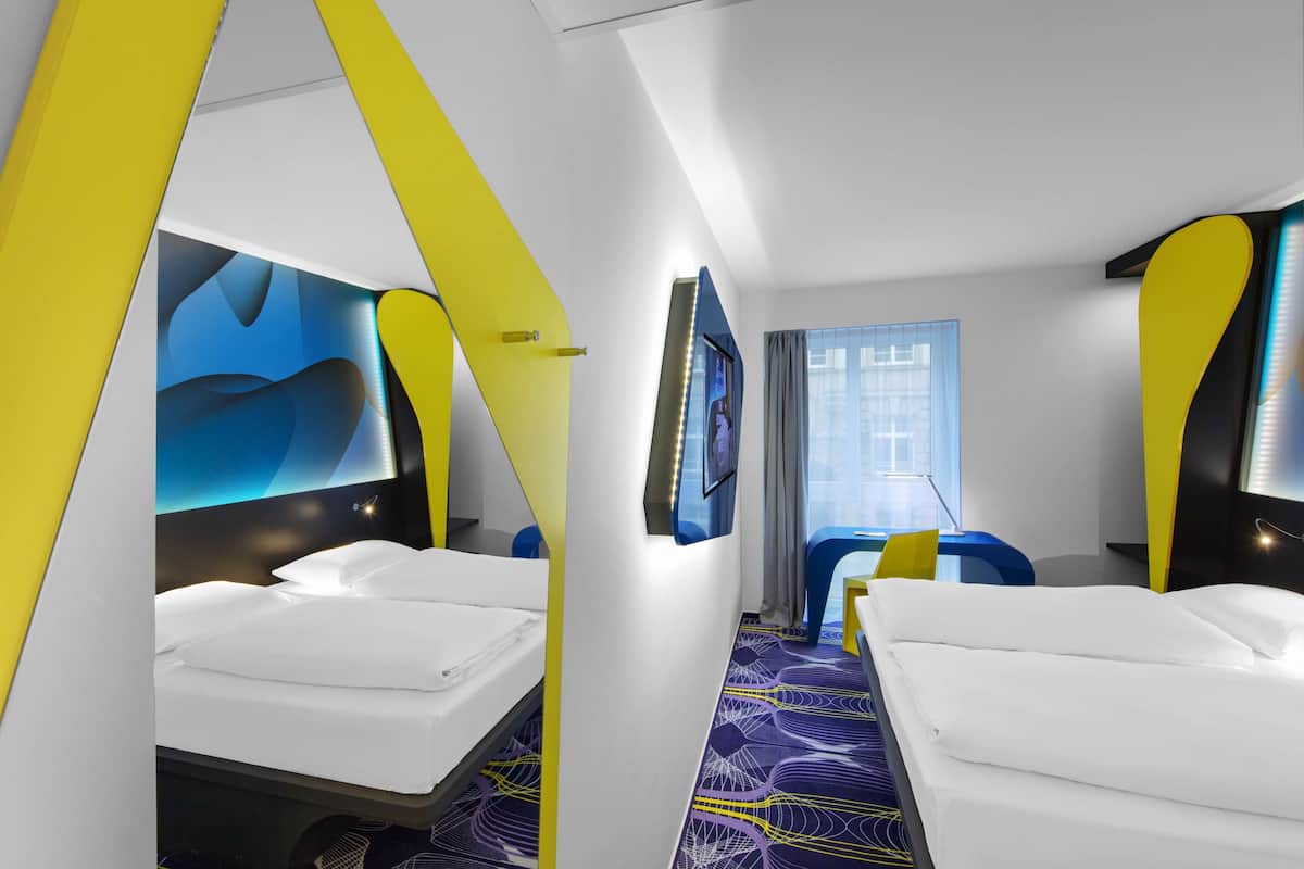 Hypo-allergenic bedding, desk, laptop workspace, blackout curtains