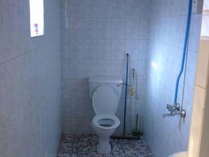 Shower, rainfall showerhead, slippers, towels