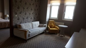 Deluxe Suite | Living area | LCD TV