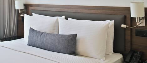 Hypo-allergenic bedding, down duvets, in-room safe, desk