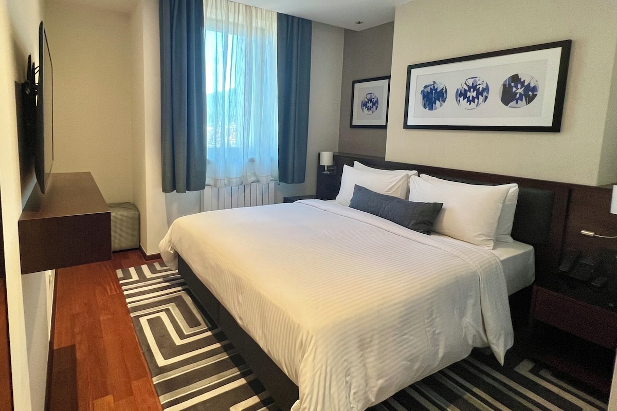 Apartment, 2 Bedrooms, City View | Hypo-allergenic bedding, down comforters, in-room safe, desk