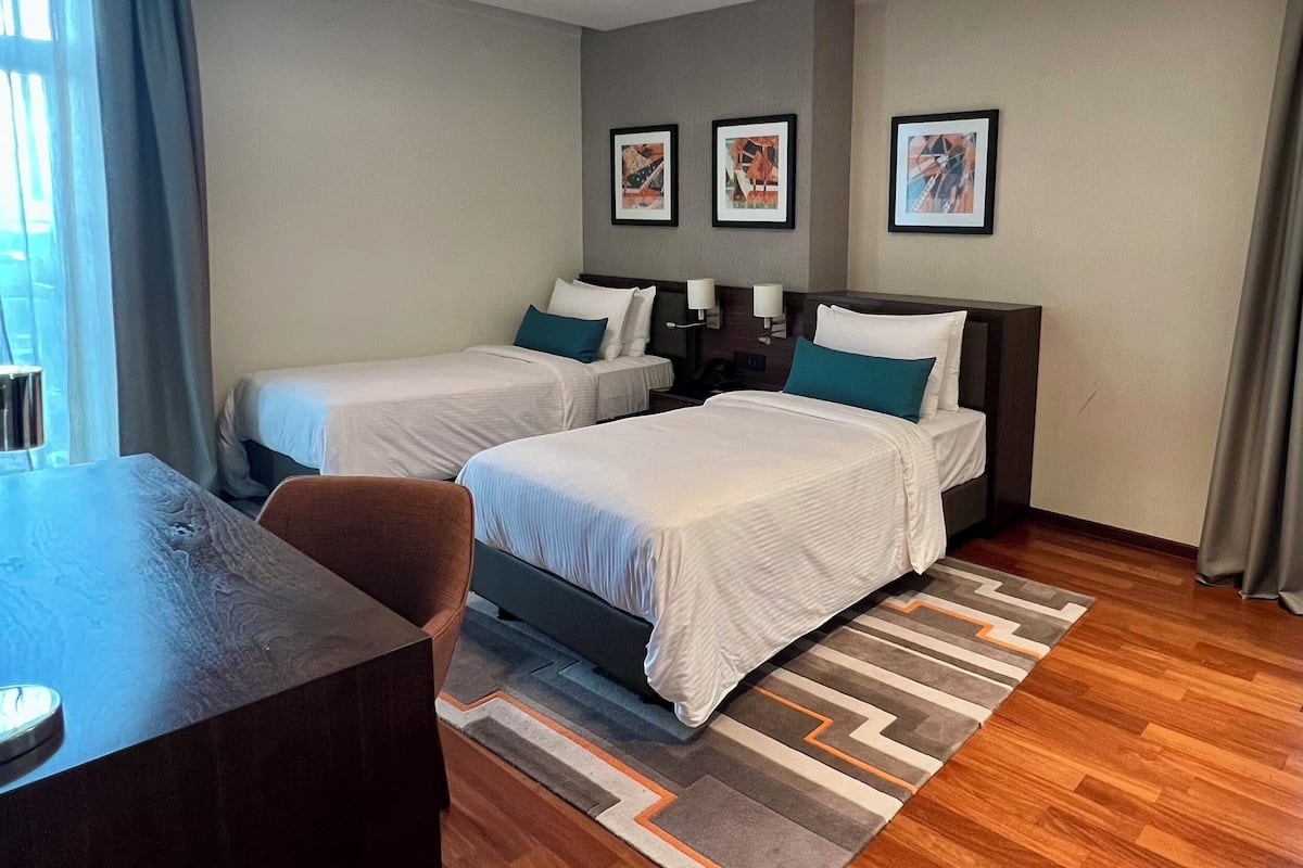 Apartment, 2 Bedrooms, Balcony (Spacious) | Hypo-allergenic bedding, down comforters, in-room safe, desk