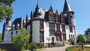 A historic building with multiple towers and a central entrance. - off in the summer 08 (Jabel)
