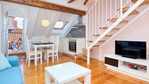 A modern apartment with a dining area, kitchen, and living room. - Hedera Estate, Hedera A31 Apartment (Dubrovnik)