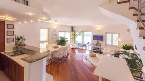 A spacious living area with a kitchen, dining table, and a staircase. - Hedera Estate, Hedera A14 (Dubrovnik)