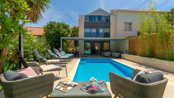 Outdoor pool, a heated pool, sun loungers