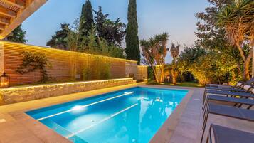 Outdoor pool, a heated pool, sun loungers