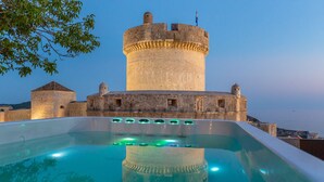 A castle with a large tower and a swimming pool in front. - Hedera Estate, Villa Hedera V (Dubrovnik)