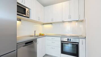 Apartment (2 Bedrooms) | Private kitchen | Coffee/tea maker, full-size fridge, microwave, oven