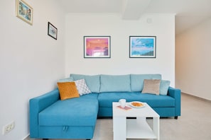 City Apartment, Patio (1 Bedroom) | Living area | Flat-screen TV