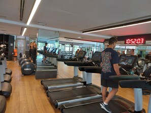 A gym with treadmills, weights, and cardio equipment. - INDIGO TLV (Tel Aviv)