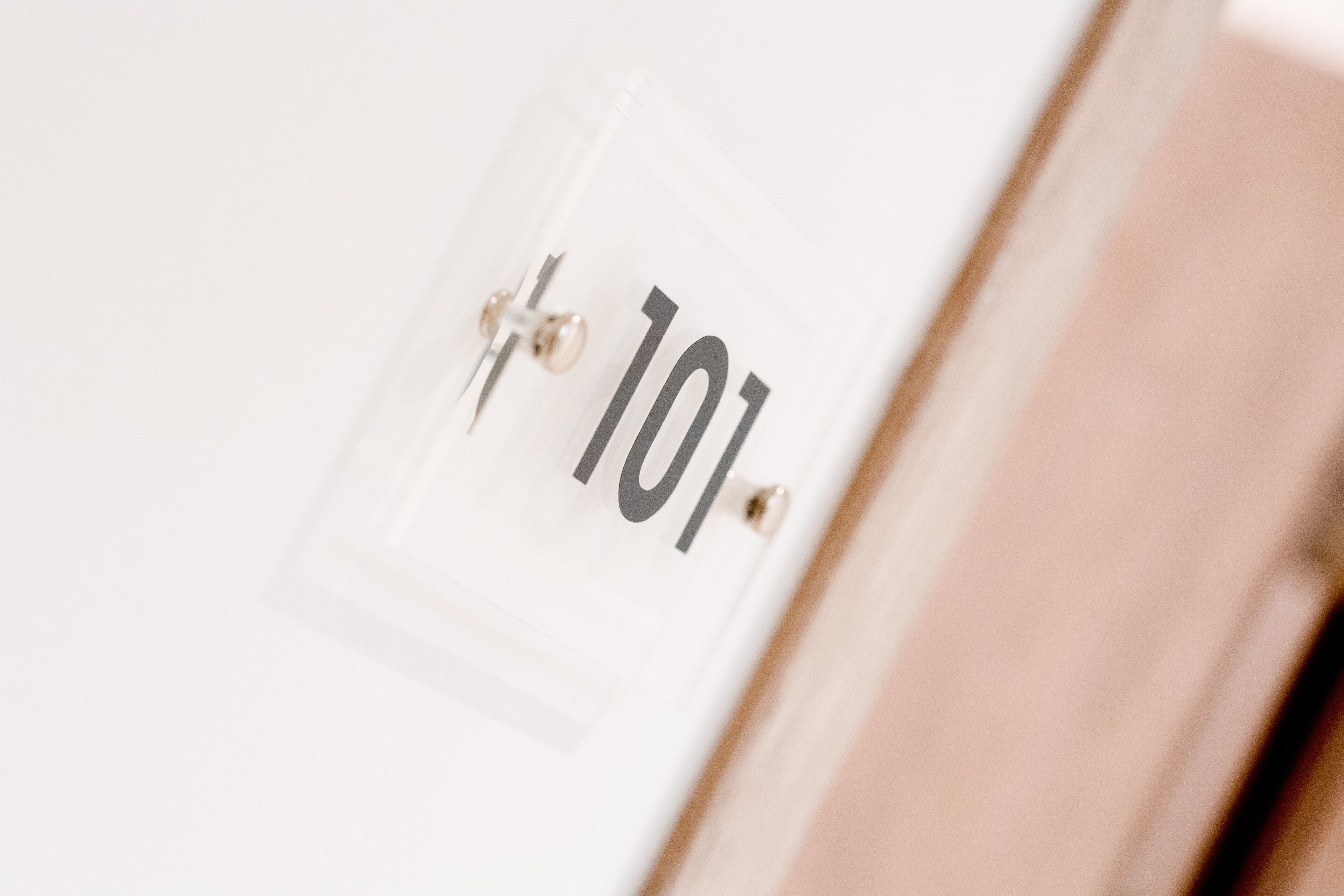 A close-up of a door with the number 101 on it.