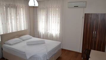 Family Apartment, 3 Bedrooms, Non Smoking, Refrigerator | In-room safe, desk, laptop workspace, blackout drapes