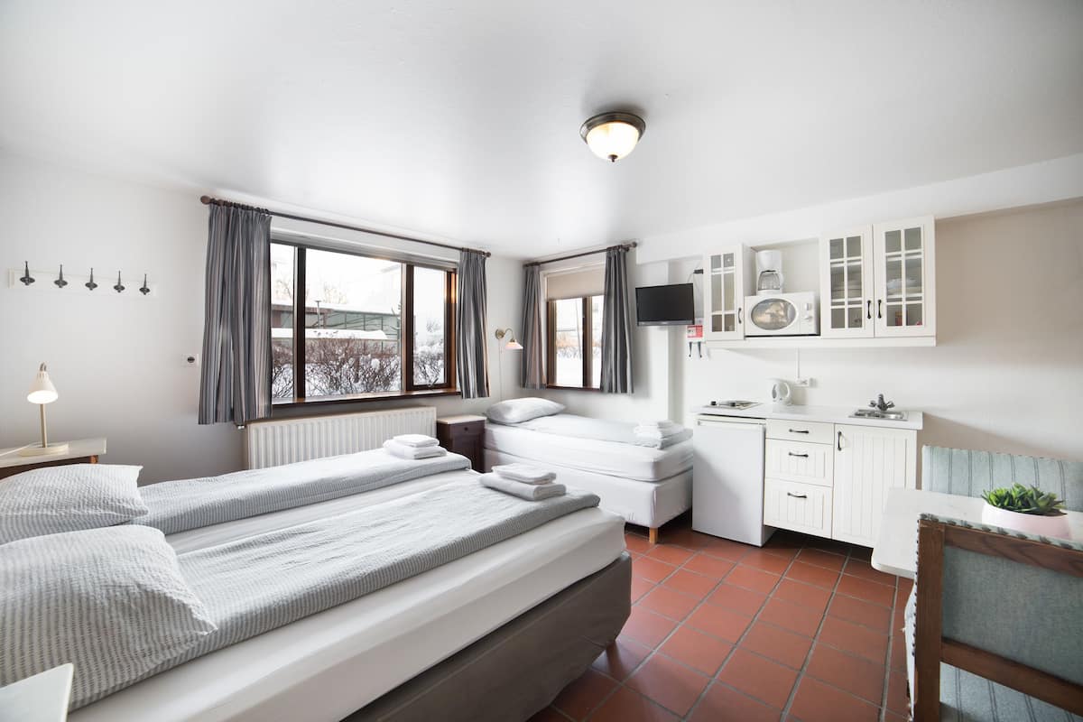 Desk, blackout curtains, free cots/infant beds, free WiFi
