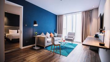 Suite, 1 King Bed (Additional Living Area) | In-room safe, soundproofing, iron/ironing board, free WiFi