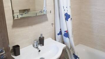 Exclusive Apartment | Bathroom | Bathtub, towels, soap, shampoo