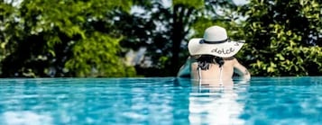 Indoor pool, seasonal outdoor pool, pool umbrellas, pool loungers