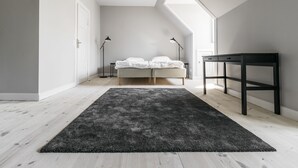A bedroom with a bed, a desk, and a large window. - Apartment with Private Terrace (Copenhagen)