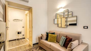 Apartment, 1 Bedroom | Living room | Flat-screen TV