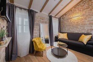 Suite – junior | Oppholdsområde | Flatskjerm-TV