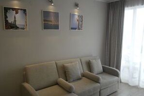 Standard Apartment, 1 Bedroom, Balcony, Beachside | Living room | 24-inch flat-screen TV with cable channels, TV - Hotel Helios (Balchik)