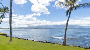 A golf course with a view of the ocean and mountains in the distance. - Uninterrupted Ocean views, 70" of Entertainment (Wailuku)