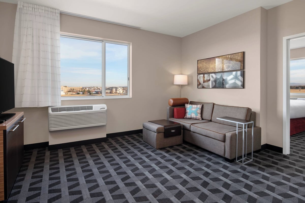 suite, 1 king bed | living room | smart tv