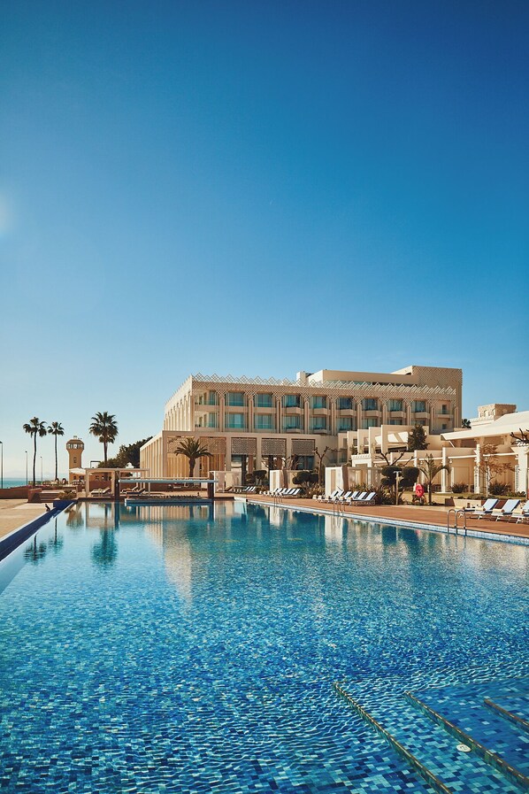 Indoor pool, outdoor pool, free pool cabanas, pool umbrellas