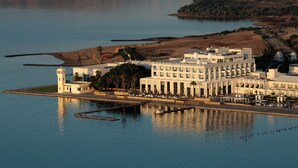 A large hotel with multiple buildings, a lighthouse, and a marina. - Marchica Lagoon Resort (Beni Ansar)