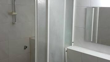 Shower, towels, soap, toilet paper