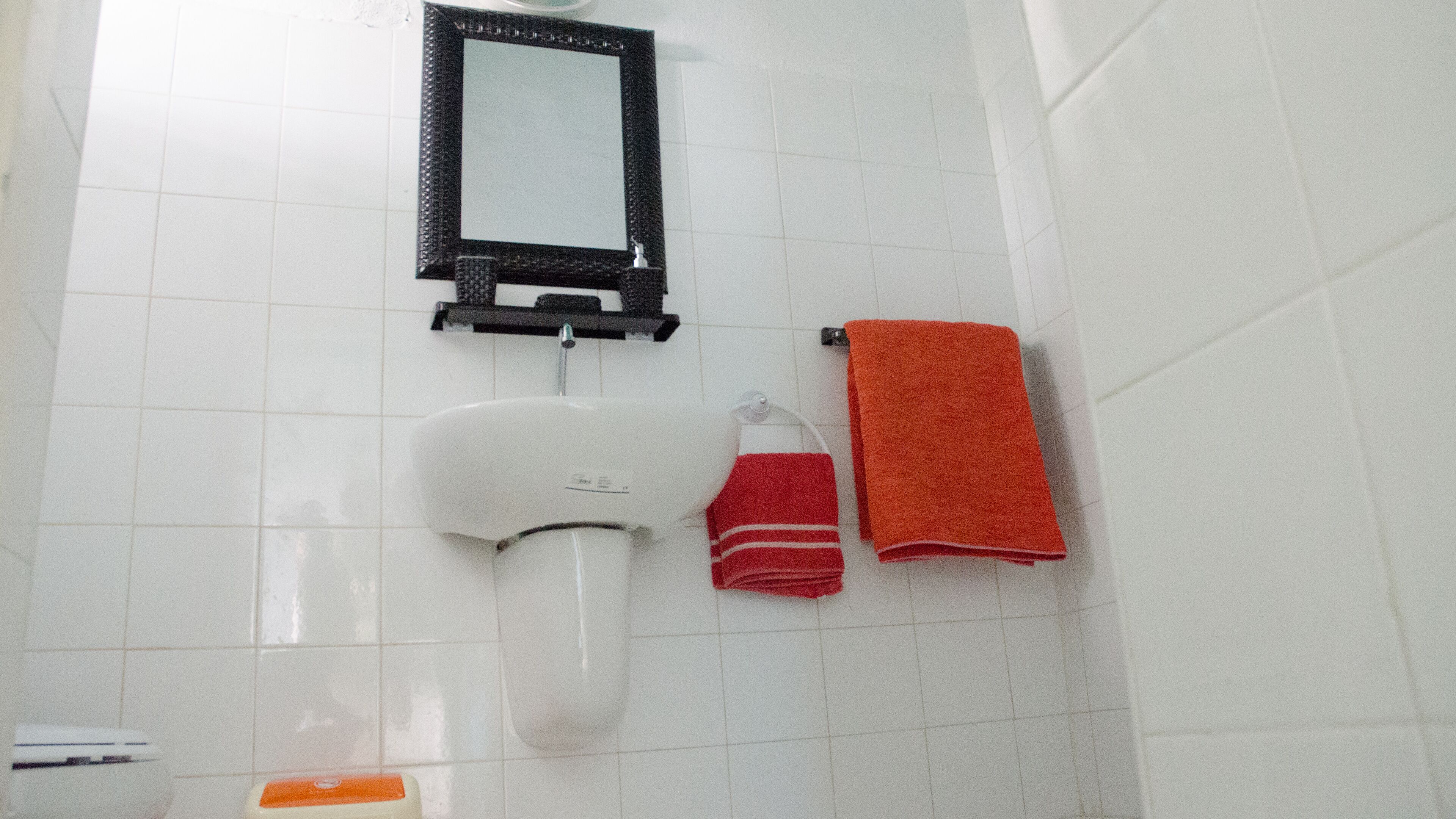 rainfall showerhead, towels, soap, toilet paper
