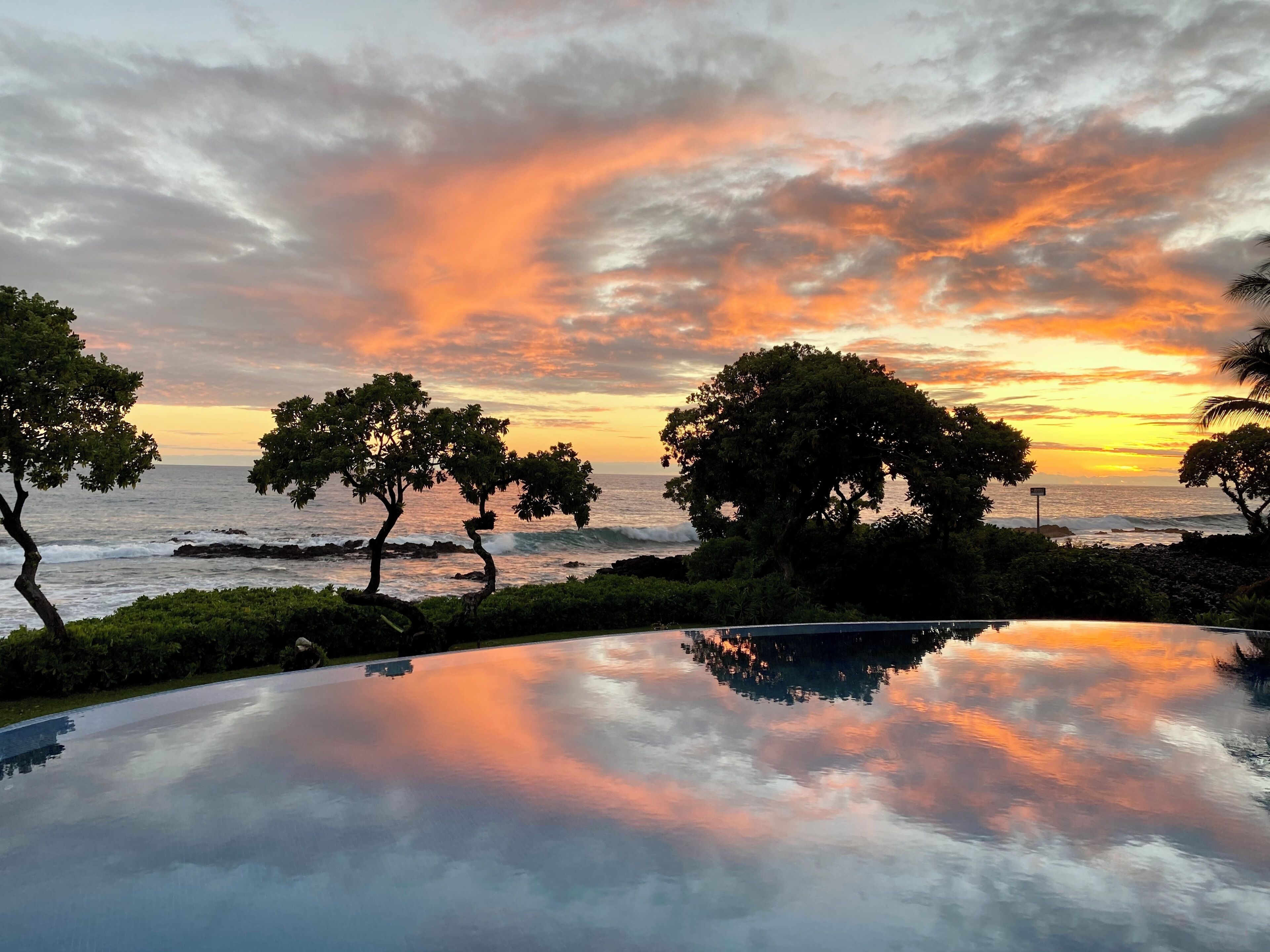 Infinity pool just steps from the Pacific—front-row Kona sunsets