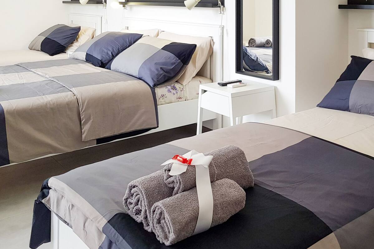 Deluxe Quadruple Room | Select Comfort beds, desk, laptop workspace, WiFi (free)