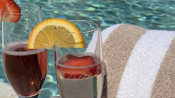 Outdoor pool, open 6:00 AM to 10:00 PM, pool umbrellas, pool loungers