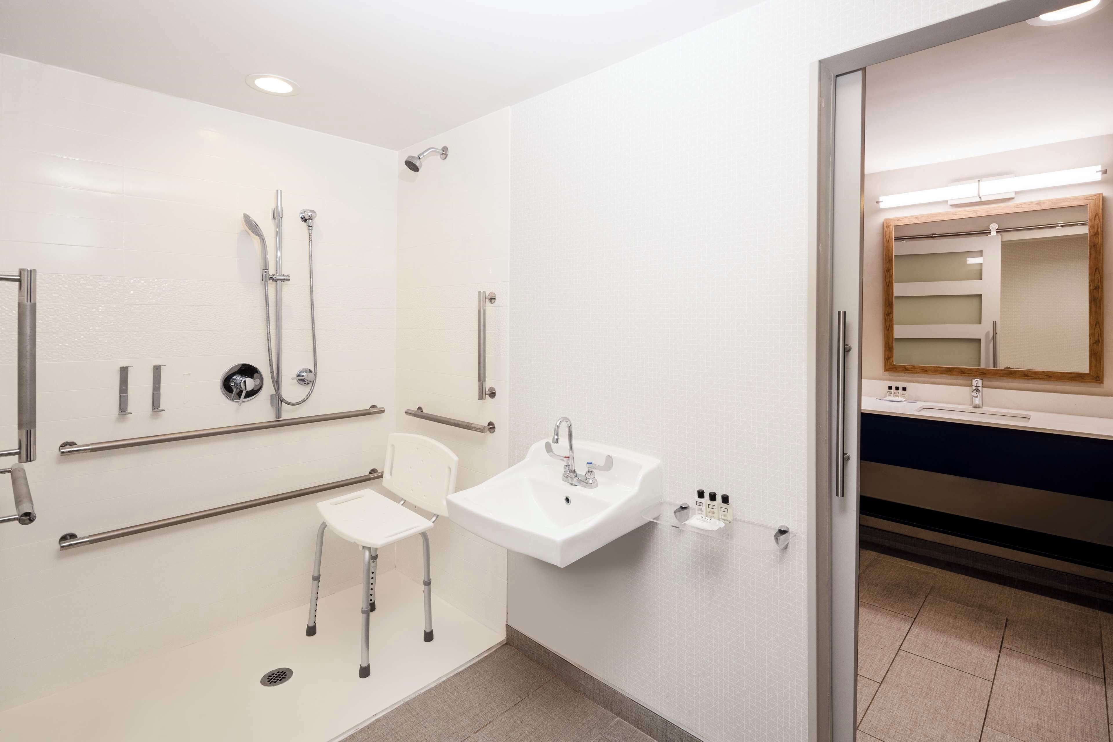 designer toiletries, hair dryer, towels, soap