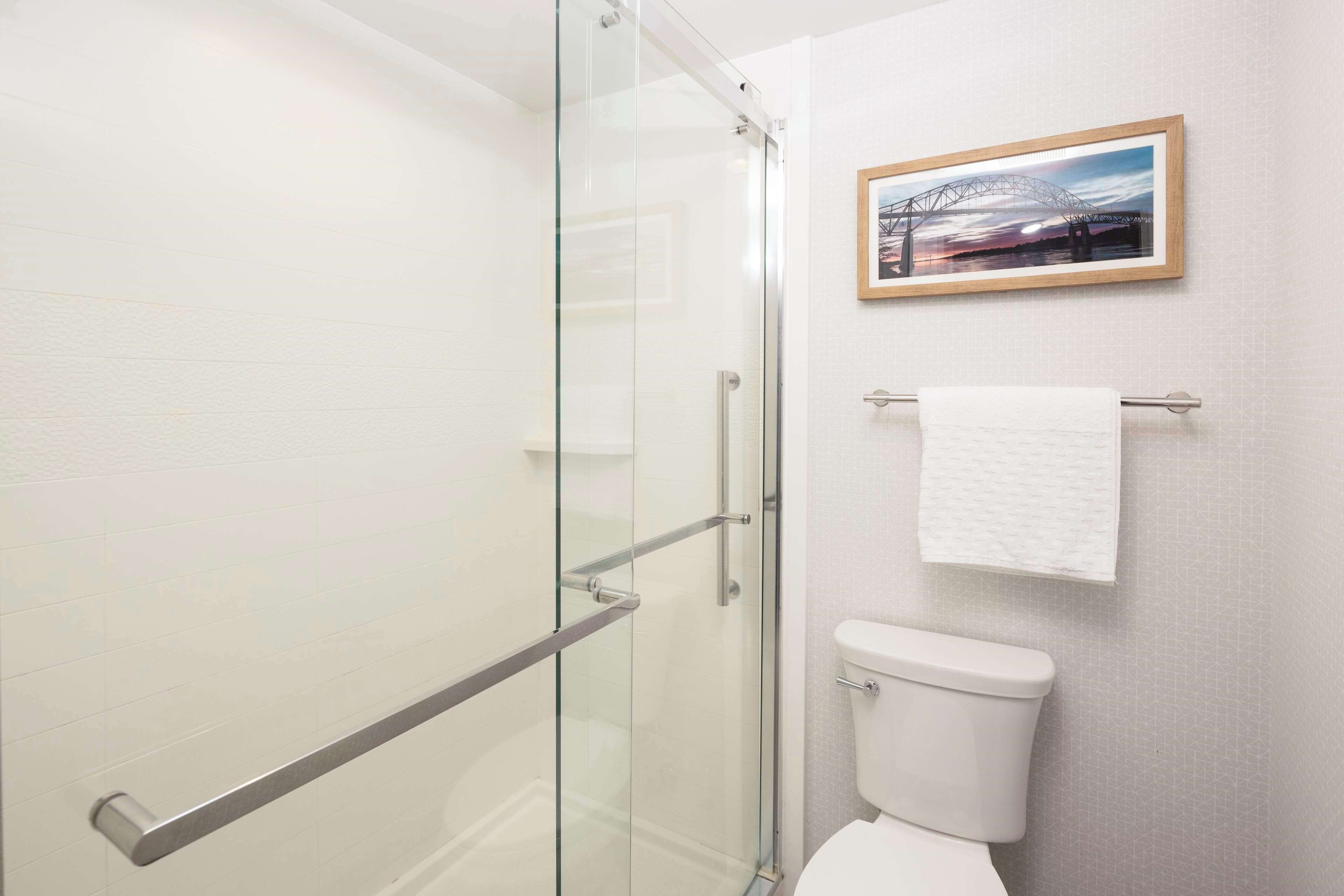 designer toiletries, hair dryer, towels, soap