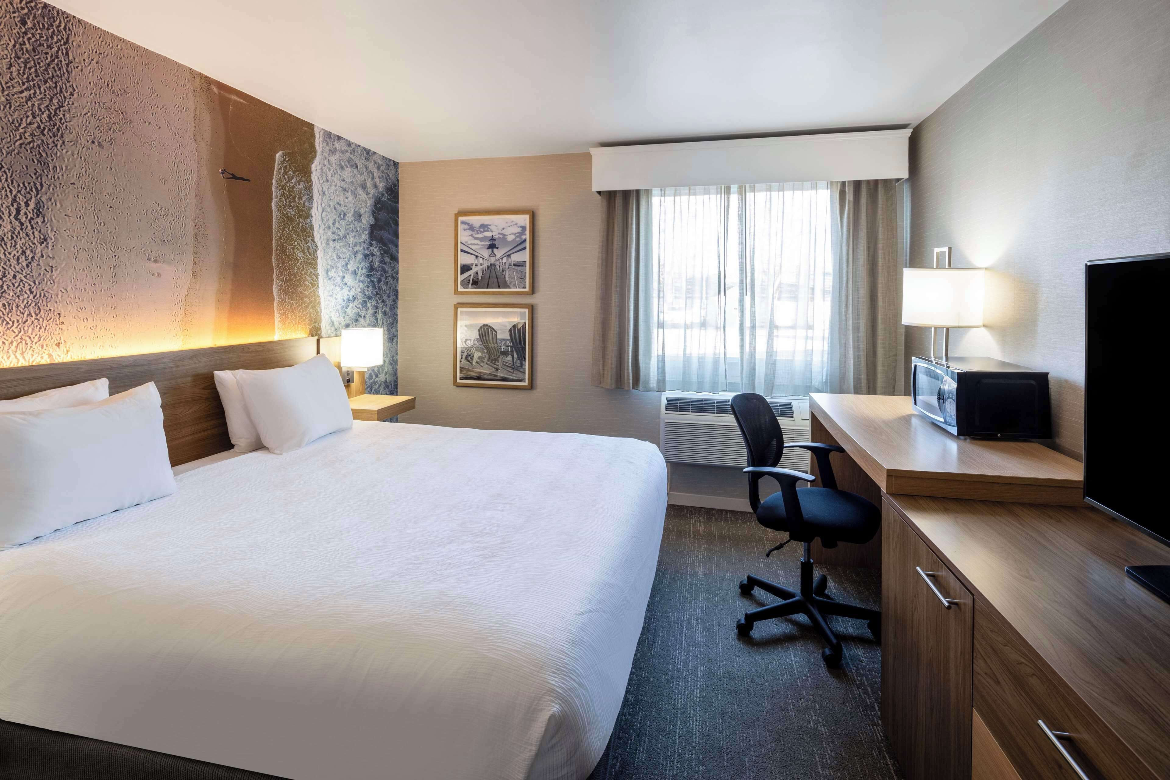 premium bedding, desk, laptop workspace, blackout curtains